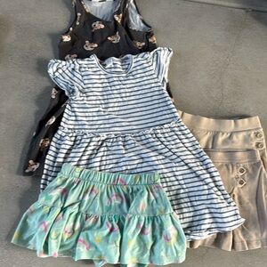 Girls size 6 bundle. Includes 2 uniform skirts, 2 dresses and a skort.